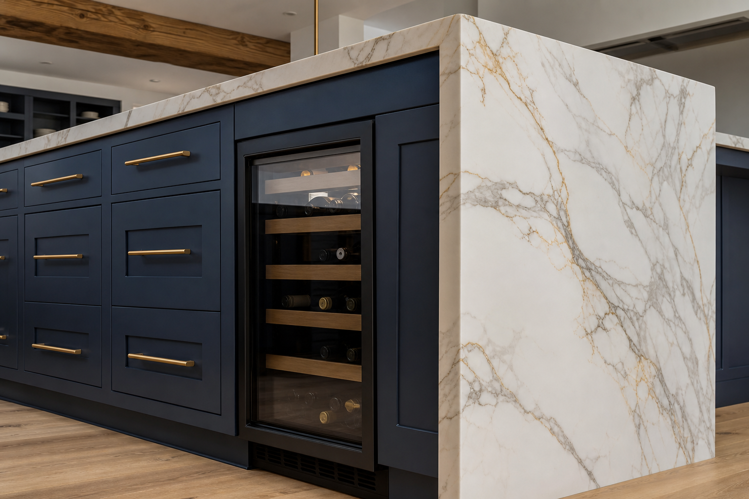 Navy island with Calacatta marble waterfall edge and brass hardware